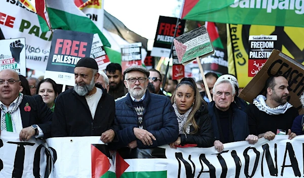 Former UK Labour party leader Jeremy Corbyn (C) joins protesters with placards and flags taking part in the 'National March For Palestine' in central London on November 11, 2023 (AFP)