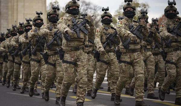 Members of a Romanian special operations unit march during the National Day parade in Bucharest, Romania, Friday, Dec 1 2023 (AP)