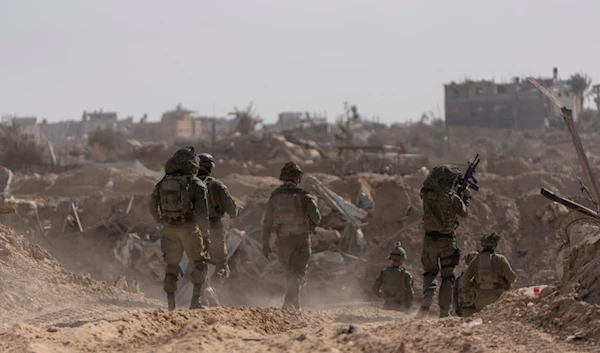 Israeli soldiers take up positions during a ground invasion in Khan Younis, Gaza Strip on Wednesday, Jan. 10. 2024. (AP Photo/Ohad Zwigenberg)