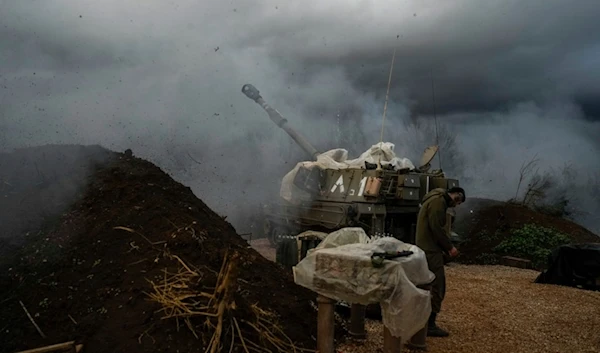 An Israeli mobile artillery unit fires a shell from northern Palestine towards Lebanon, Thursday, Jan. 11, 2024. (AP Photo/Leo Correa)