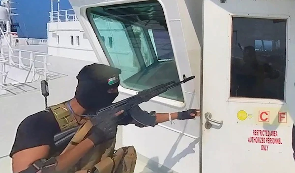 Yemeni Resistance fighters boarding the cargo ship Galaxy Leader on Sunday, Nov. 19, 2023 (AP)