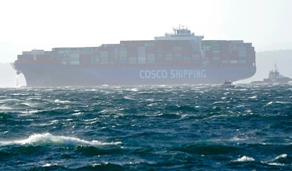 A Cosco Shipping cargo container boat is shown with its anchor out on rough seas in Elliott Bay, Tuesday, Oct. 13, 2020, in Seattle. (AP)