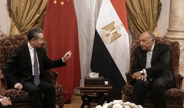 Egyptian Foreign Minister Sameh Shoukry, right, meets his Chinese counterpart Wang Yi at Tahrir palace in Cairo, Egypt, Sunday, Jan. 14, 2024. (AP)