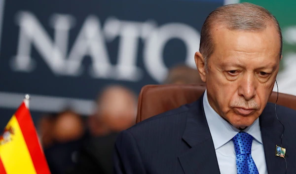 Turkish President Recep Tayyip Erdogan waits for the start of a round table meeting of the North Atlantic Council during a NATO summit in Vilnius, Lithuania, on July 11, 2023.(AP)