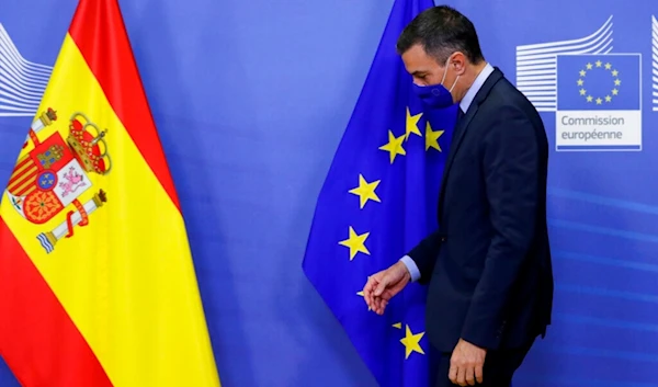 Spain's Prime Minister Pedro Sanchez walks by the EU flag prior to a meeting with European Commission President Ursula von der Leyen at EU headquarters in Brussels, Wednesday, Sept. 23, 2020. (AP)