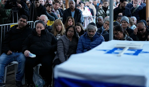 Israelis attend a funeral of an Israeli soldier in 'Mevo'ot HaHermon' Regional Council in occupied Palestine, January 15, 2024 (AP)