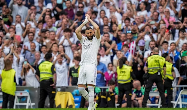 Real Madrid's Karim Benzema claps to supporters during the Spanish La Liga soccer match against Athletic Bilbao at the Santiago Bernabeu stadium in Madrid, Sunday, June 4, 2023. (AP)