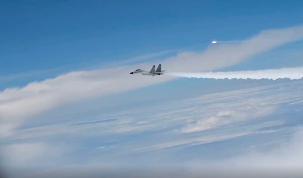 This image from video provided by the US Department of Defense, shows an intercept of a US warplane by Chinese aircraft in the Pacific Ocean on April 29, 2022 (AP)