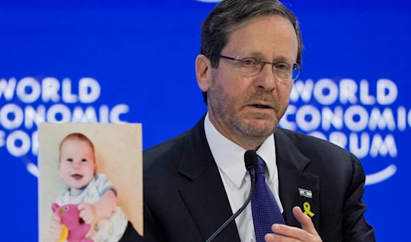 Herzog accused of war crimes at Davos