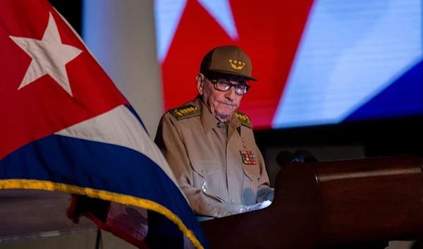 Former Cuban President Raul Castro looks at the Cuban flag during his speech at the event celebrating the 65th anniversary of the triumph of the revolution in Santiago, Cuba, Monday, Jan. 1, 2024. (AP)