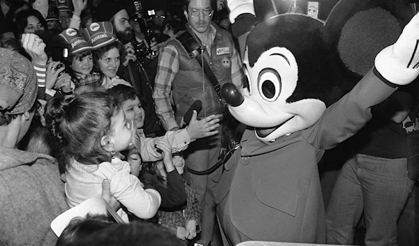 Mickey Mouse greets fans in Chicago on Nov. 15, 1978, as his cross-country whistle stop train arrived at Union Station. (AP)