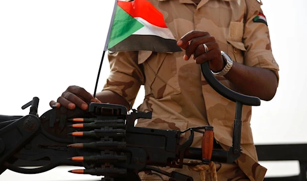 In this June 22, 2019 file photo, a Sudanese soldier from the Rapid Support Forces, stands on his vehicle during a military-backed tribe's rally, in the East Nile province, Sudan. (AP)