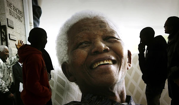 Giant photographs of former South African President Nelson Mandela are displayed at the Nelson Mandela Legacy Exhibition at the Civic Centre in Cape Town, South Africa, on June 27, 2013. (AP)