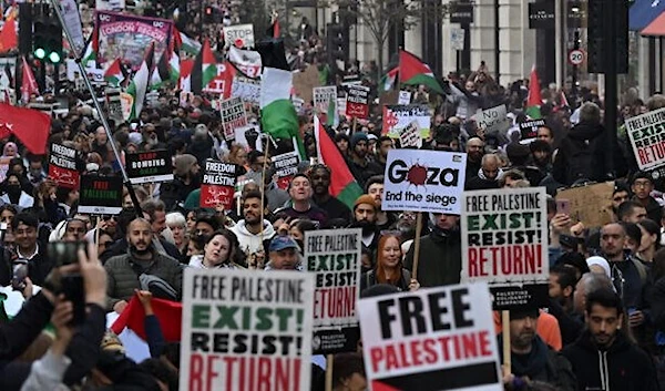 People walk down Regent Street as they take part in a 'March For Palestine' in London on October 14, 2023. (AFP)