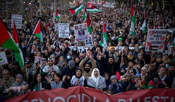 People march during a protest in support of Palestinians and calling for an immediate ceasefire in Gaza, in Barcelona, Saturday, Jan. 20, 2024 (AP Photo/Emilio Morenatti)