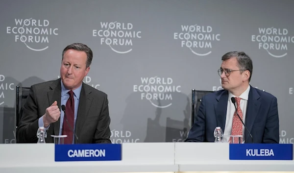 Britain's Foreign Secretary David Cameron, left, and Ukraine's Foreign Minister Dmytro Kuleba take part in a panel discussion at the Annual Meeting of World Economic Forum in Davos, Switzerland, Wednesday, Jan. 17, 2024. (AP)