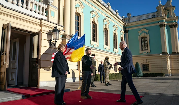 President Joe Biden, right, meets with Ukrainian President Volodymyr Zelenskyy, center, and Olena Zelenska, left, spouse of President Zelenskyy, at Mariinsky Palace during an unannounced visit in Kyiv, Ukraine, Monday, Feb. 20, 2023(AP)