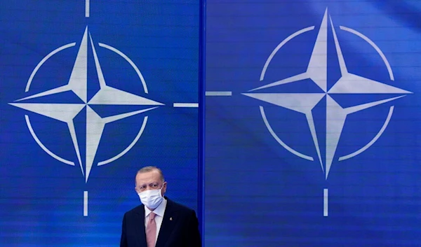 Turkish President Recep Tayyip Erdogan arrives to pose for photos with NATO Secretary General Jens Stoltenberg at the NATO summit at NATO headquarters in Brussels, Monday, June 14, 2021. (AP )