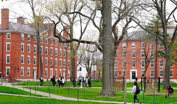 Students walk through Harvard Yard, April 27, 2022, on the campus of Harvard University in Cambridge, Mass (AP)