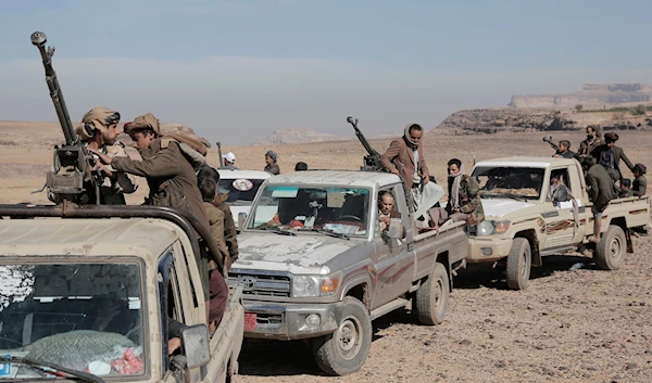 Houthi fighters attend a rally of support for the Palestinians in the Gaza Strip and against the U.S. strikes on Yemen outside Sanaa on Monday, Jan. 22, 2024. (AP)