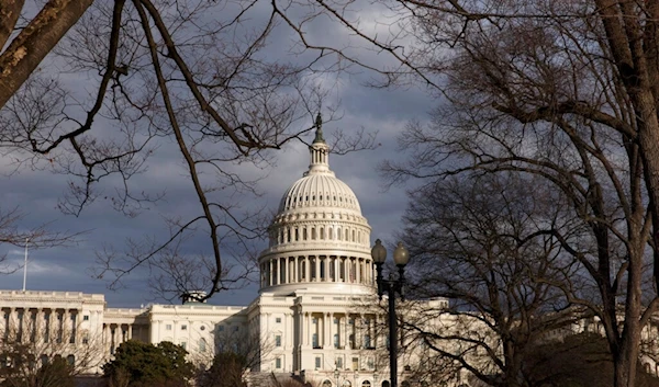 U.S. Capitol as dark skies recede following blustery weather, Friday, Feb. 21, 2014, in Washington. (AP)