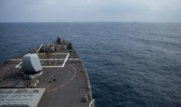 The Arleigh Burke-class guided-missile destroyer USS Laboon approaches the oiler USNS Kanawha (background) for replenishment-at-sea operation in the Red Sea on December 25, 2023, in this handout photo. (US Department of Defense / AFP)