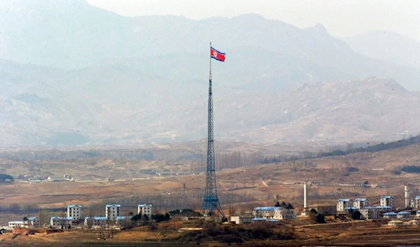 A DPRK flag is seen atop a 160-meter (533-foot) tower in the village of Gijungdong near the north side of the border village of Panmunjom,