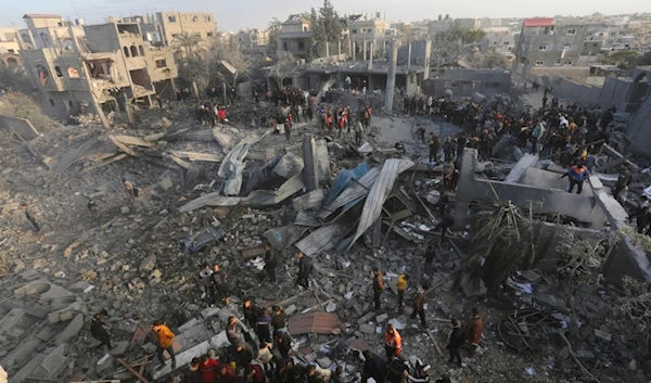 Palestinians look at a mosque destrooyed in an Israeli strike in Rafah, Gaza Strip. Wednesday, Jan. 24, 2024. (AP Photo/Hatem Ali)