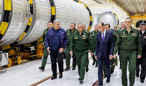 In this photo released by Russian Defense Ministry Press Service on Saturday, Oct. 7, 2023, Russian Defense Minister Sergei Shoigu, center, inspects fulfilment of the state defense order in Russia. (AP)