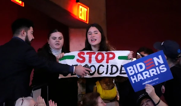 A protester interrupts President Joe Biden during an event on the campus of George Mason University in Manassas, Va., Tuesday, Jan. 23, 2024 (AP)