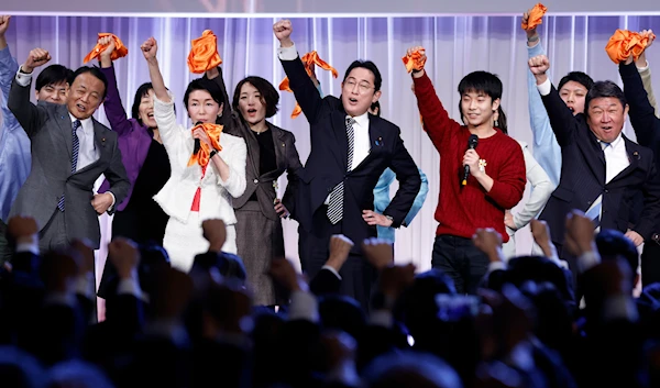 Japan's prime minister and president of the Liberal Democratic Party (LDP), raises his fist with the vice president of the LDP, secretary general of the LDP, and other party members during the party's annual convention in Japan, on Feb. 26, 2023(AP)