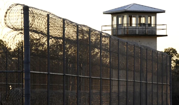 The sun sets in 2022 behind Holman Prison in Atmore, Alabama, where the state executed death row inmate Kenneth Smith using nitrogen gas. (AP)