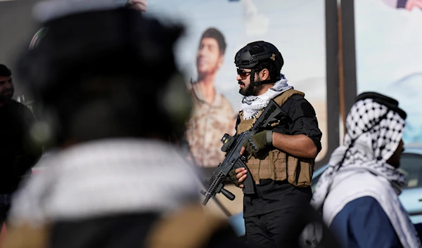 Members of an Iraqi resistance attend the funeral of a martyr with Kataib Hezbollah, who was killed in a U.S. airstrike, in Baghdad, Iraq, Thursday, Jan. 25, 2024.(AP)