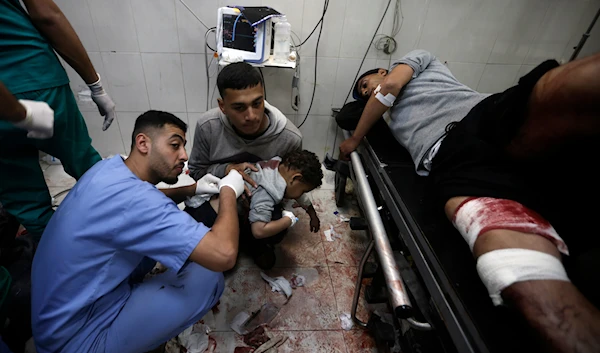 Palestinians wounded in the Israeli bombardment of the Gaza Strip receive treatment at the Nasser Hospital in Khan Younis, Southern Gaza Strip, occupied Palestine, January 22, 2024 (AP)