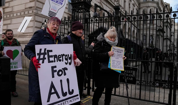 Protestors from Fuel Poverty Action group  demonstrate over the number of excess deaths in Britain due to pensioners unable to heat their homes in winter due to rising fuel costs outside Downing Street in London, on Jan. 19, 2023(AP)