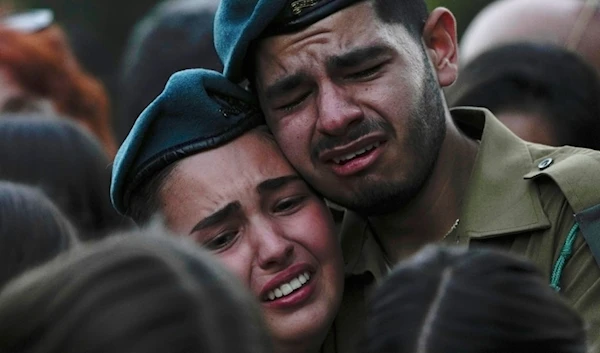 Israeli soldiers cry during the funeral of Sgt. Yam Goldstein, "Kibbutz",  Oct. 23, 2023 (AP)