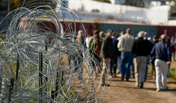 Concertina wire lines the path as members of Congress tour an area near the Texas-Mexico border, Jan. 3, 2024, in Eagle Pass, Texas.  (AP)