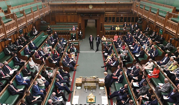 In this handout photo provided by the UK Parliament, MPs listen to Britain's Prime Minister Boris Johnson back then giving an update on the latest situation in Afghanistan in the House of Commons, London, Monday, Sept. 6, 2021(AP)