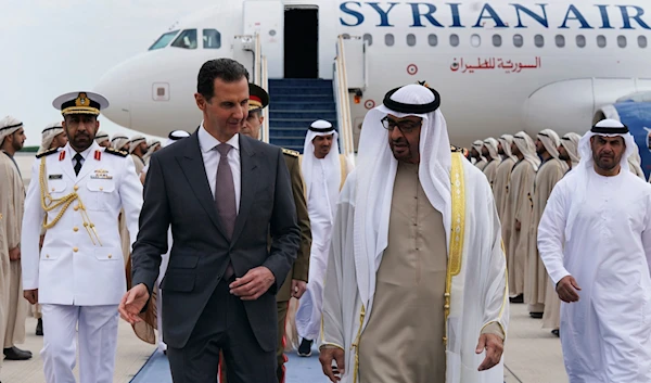 In this photo released by the Syrian Presidency, Syrian President Bashar Assad, left, speaks with UAE President Sheikh Mohammed bin Zayed al-Nahyan, in in Abu Dhabi, United Arab Emirates, March 19, 2023 (AP)