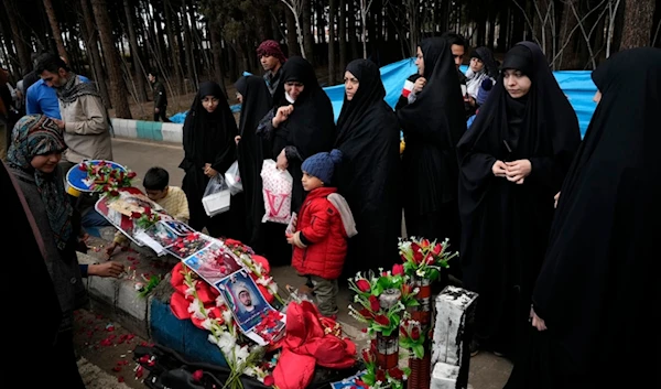 People visit the scene of Wednesday's bomb explosion in the city of Kerman 820 km (about 510 miles) southeast of Tehran, Iran, Thursday, Jan. 4, 2024. (AP)