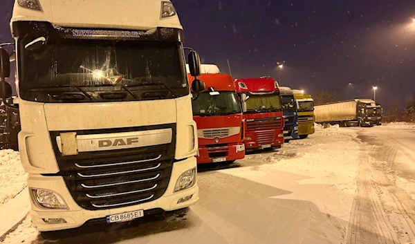 Ukrainian truck drivers wait to cross from Poland back into Ukraine in Korczowa, Poland, on Thursday Dec. 7, 2023. (AP)