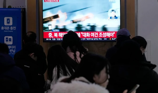 A TV screen shows a file image of North Korea's military exercise during a news program at the Seoul Railway Station in Seoul, South Korea, Saturday, Jan. 6, 2024 (AP)