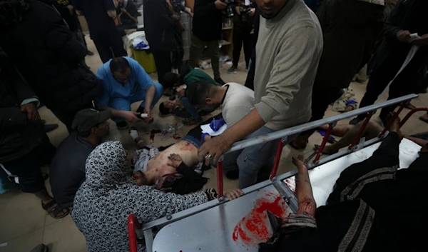 Palestinians wounded in the Israeli occupation bombardment of the Gaza Strip are brought to Al Aqsa hospital in Deir al Balah, Gaza Strip, Sunday, Jan. 7, 2024. (AP)