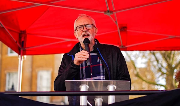 Former Labour party leader Jeremy Corbyn speaks during a protest, outside the gates of Downing Street, against the increase of the cost of living, in London, Saturday, April 2, 2022 (AP)