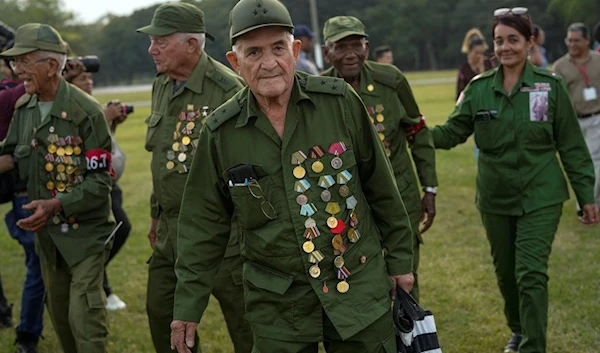 Veterans of the 1959 Cuban Revolution attend a ceremony on the 65th anniversary of the arrival of Fidel Castro to the capital as head of the revolutionary Army in Havana, Cuba, Monday, Jan. 8, 2024 (AP)