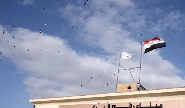 Birds fly over Rafah crossing, Egypt, Monday, Nov. 27, 2023. (AP Photo/Amr Nabil)