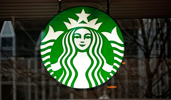 This Thursday, Jan. 12, 2017, file photo shows a Starbucks logo sign in the window of one of the chain's cafes in Pittsburgh, US. (AP)