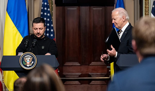 President Joe Biden and Ukrainian President Volodymyr Zelenskyy depart a news conference in the Indian Treaty Room in the Eisenhower Executive Office Building on the White House Campus, Tuesday, Dec. 12, 2023, in Washington. (AP)