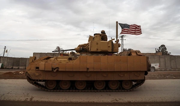 US occupation soldiers patrol in a fighting vehicle in Hassakeh, Syria, Tuesday, Feb. 8, 2022. (AP)