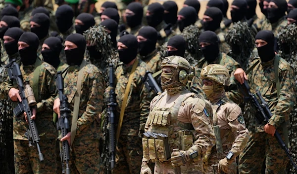 Fighters from the Lebanese resistance group Hezbollah carry out a training exercise in Aaramta village in the Jezzine District, southern Lebanon, Sunday, May 21, 2023 (AP Photo/Hassan Ammar)